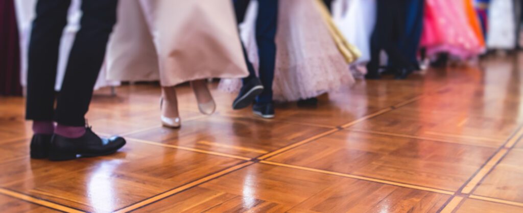 Low angle photograph of couples on a dance floor.